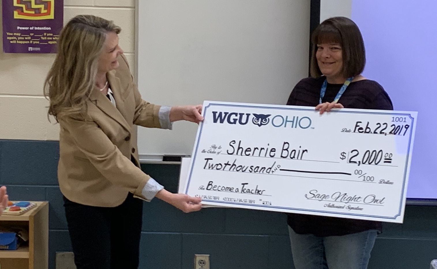 Sherrie Bair with check from WGU Ohio
